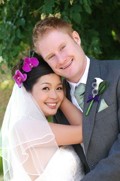 Wedding calla lily buttonhole and orchid hair accessory