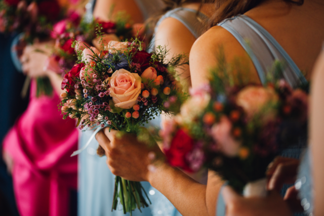 Warm mixed bouquet including Wax flower, Roses, and Nigella, Floral design by Cotswold Blooms, wedding florist based in Cheltenham.