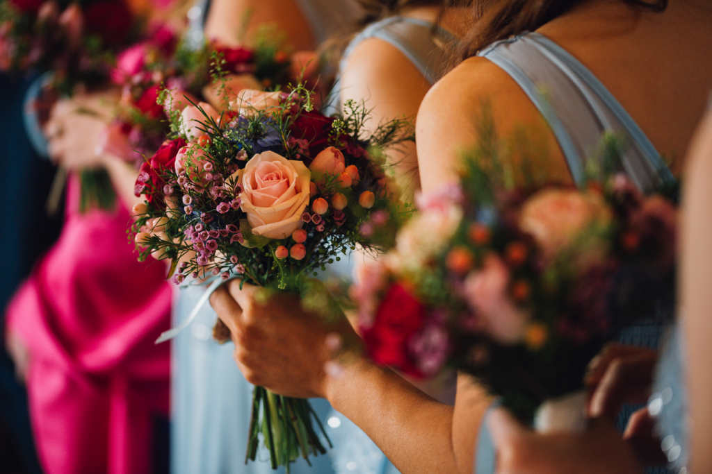 Warm mixed bouquet including Wax flower, Roses and Nigella
