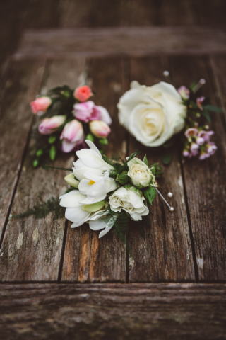 Mixed Spray Rose and Freesia buttonholes. Floral design by Cotswold Blooms, wedding florist based in Cheltenham.