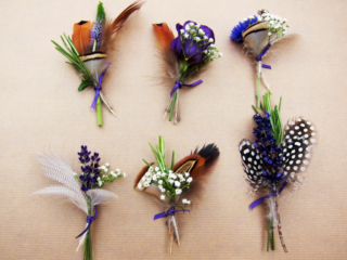 Mixed buttonholes with feather detail. Floral design by Cotswold Blooms, wedding florist based in Cheltenham.