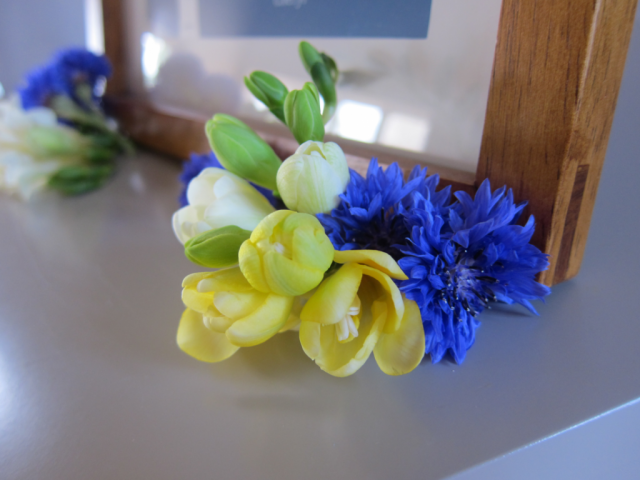 Cornflower and yellow Freesia detailed display. Floral design by Cotswold Blooms, wedding florist based in Cheltenham.