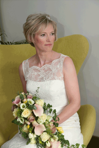 A vintage style shower bouquet using trailing Ivy. Cowley Manor, Cheltenham. Floral design by Cotswold Blooms, wedding florist based in Cheltenham.