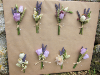 Mixed country garden buttonholes in lilac with dried crops and Lavender. Floral design by Cotswold Blooms, wedding florist based in Cheltenham.