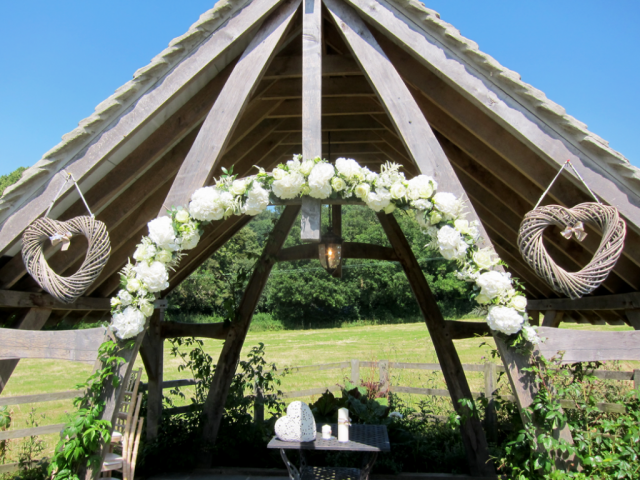 Hydrangea and Rose arch arrangement. Floral design by Cotswold Blooms, wedding florist based in Cheltenham.