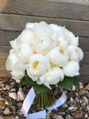 Domed white peony bouquet with a foliage base. Floral design by Cotswold Blooms, wedding florist based in Cheltenham.