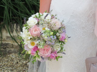 Brides bouquet made with wax flowers, lavender, freesia and roses. Floral design by Cotswold Blooms, wedding florist based in Cheltenham.