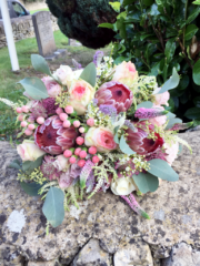 Protea, Roses, Hypericum, Astilbe and Poplus brides bouquet. Floral design by Cotswold Blooms, wedding florist based in Cheltenham.