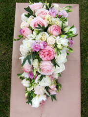 Shower bouquet of Roses, Freesia and a touch of foliage. Floral design by Cotswold Blooms, wedding florist based in Cheltenham.