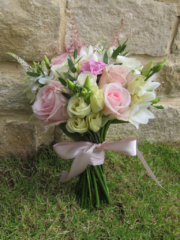 Hand tied bridesmaid bouquet in light pink and white. Floral design by Cotswold Blooms, wedding florist based in Cheltenham.
