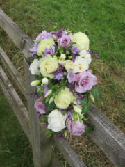 Lilac and cream shower bouquet with Roses, Freesia and Ivy. Floral design by Cotswold Blooms, wedding florist based in Cheltenham.