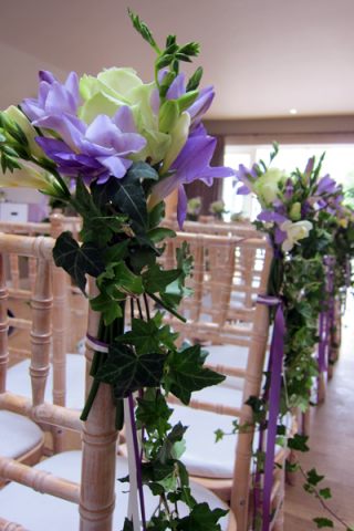 Aisle markers of Roses, Freesia and trailing Ivy at Hyde House. Floral design by Cotswold Blooms, wedding florist based in Cheltenham.
