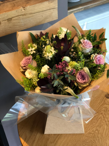 Gift wrapped bouquet. Floral design by Cotswold Blooms, wedding florist based in Cheltenham.