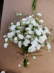 Gypsophila buttonhole tied with twine. Floral design by Cotswold Blooms, wedding florist based in Cheltenham.