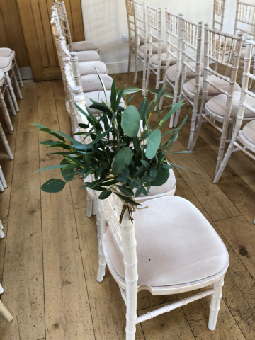 Mixed foliage aisle marker. Floral design by Cotswold Blooms, wedding florist based in Cheltenham.