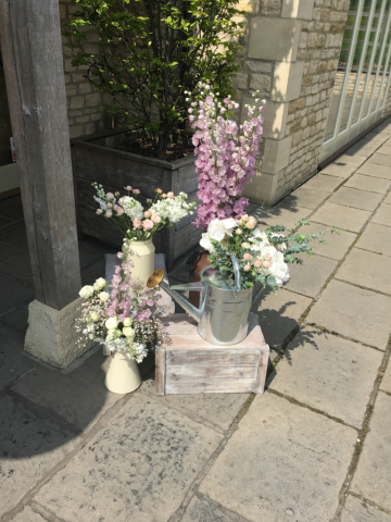 Entrance display in light pink, mauve and white. Floral design by Cotswold Blooms, wedding florist based in Cheltenham.
