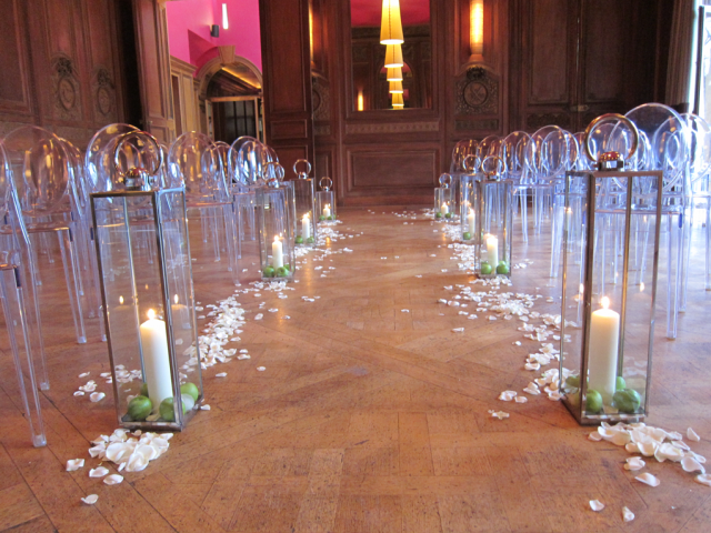 Lanterns with apples and petals down the aisle at Cowley Manor. Floral design by Cotswold Blooms, wedding florist based in Cheltenham.