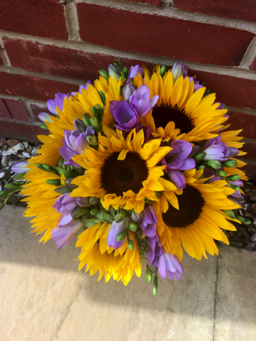 Sunflower and lilac Freesia bouquet. Floral design by Cotswold Blooms, wedding florist based in Cheltenham.