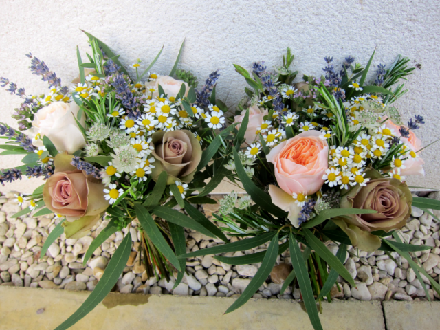 Country garden wedding bouquet including Tanacetum, garden Roses, Lavender and mixed foliage. Floral design by Cotswold Blooms, wedding florist based in Cheltenham.