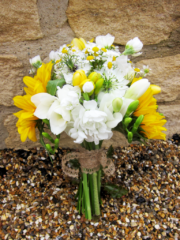 Yellow and white bouquet including Sunflower, Freesia, Stocks. Floral design by Cotswold Blooms, wedding florist based in Cheltenham.