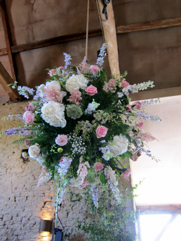 Light pink Roses, Delphinium and Cow Parsley flower ball at Cripps Barn. Floral design by Cotswold Blooms, wedding florist based in Cheltenham.