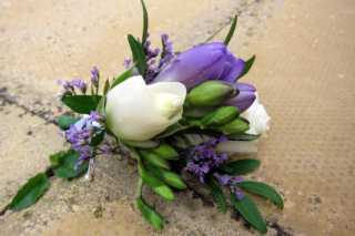 Rose, freesia and limonium corsage. Floral design by Cotswold Blooms, wedding florist based in Cheltenham.