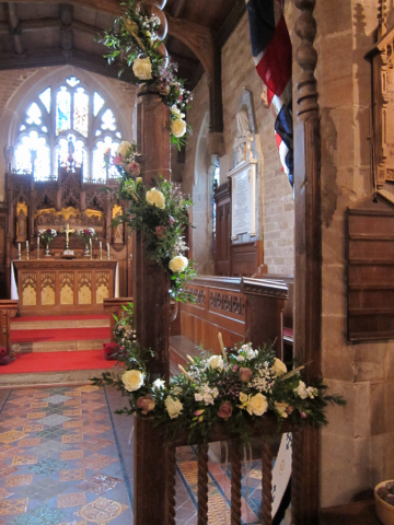 Church display in white, dusky and light pink at How Caple Court. Floral design by Cotswold Blooms, wedding florist based in Cheltenham.