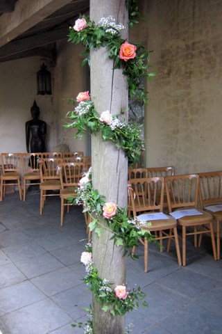 Decorative garland with Miss Piggy Roses and Gypsophila. Floral design by Cotswold Blooms, wedding florist based in Cheltenham.