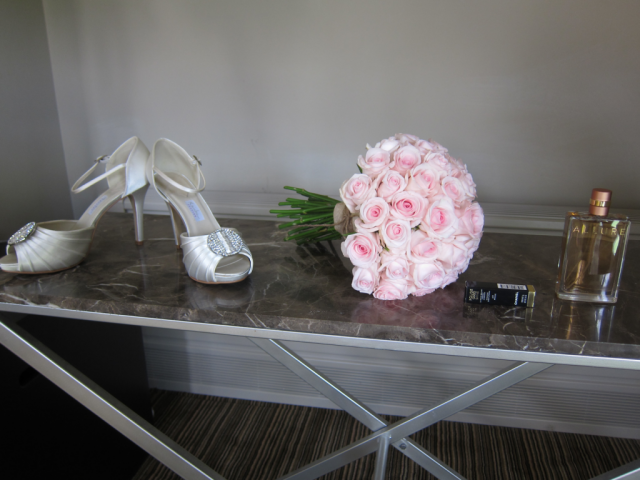 Light pink domed Rose bouquet with hessian tie. Floral design by Cotswold Blooms, wedding florist based in Cheltenham.