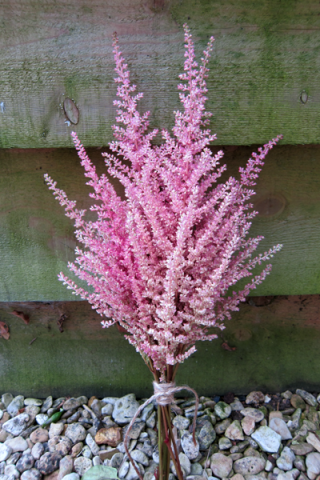 Astilbe flower girl posy. Floral design by Cotswold Blooms, wedding florist based in Cheltenham.