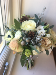 Winter bouquet with pine cone and Brunia detail. Floral design by Cotswold Blooms, wedding florist based in Cheltenham.
