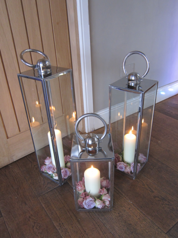 Lantern displays with Roses. Floral design by Cotswold Blooms, wedding florist based in Cheltenham.