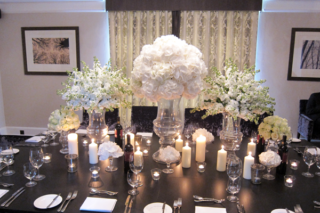 Glass urn display at Fox Hill Manor, using Hydrangeas, Roses and Stocks. Floral design by Cotswold Blooms, wedding florist based in Cheltenham.