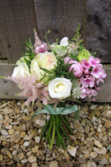 Cream, green and pink seasonal bridesmaid bouquet. Floral design by Cotswold Blooms, wedding florist based in Cheltenham.