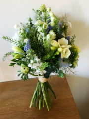 Upright hand tied bouquet in white, blue and green with Delphinium, Stocks, Freesia and Muscari. Floral design by Cotswold Blooms, wedding florist based in Cheltenham.