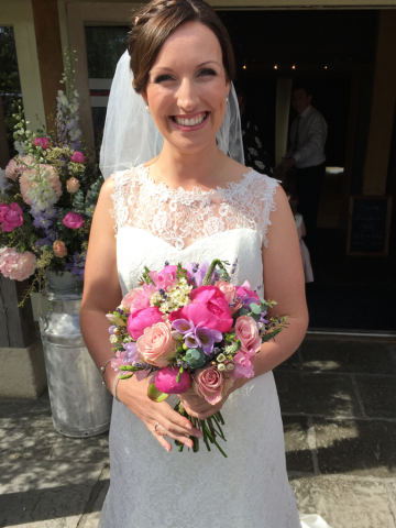 Country garden hand tied bouquet in pastel shades. Floral design by Cotswold Blooms, wedding florist based in Cheltenham.