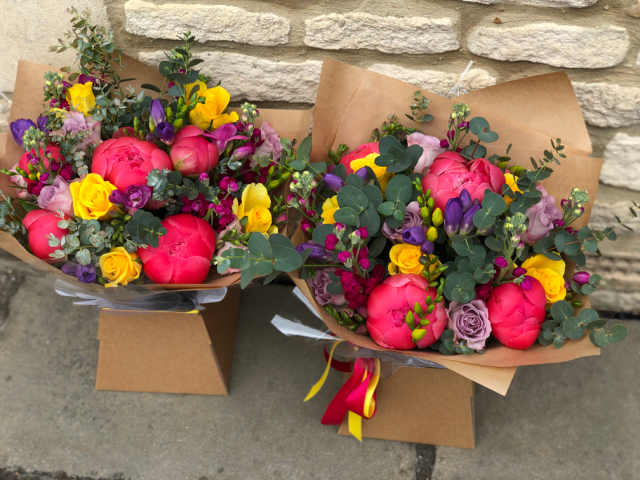 Bright and vibrant gift bouquets in aqua packs and boxes. Floral design by Cotswold Blooms, wedding florist based in Cheltenham.