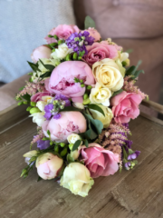 Shower bouquet in pastel shades including Roses, Peonies, stocks, and Freesia. Floral design by Cotswold Blooms, wedding florist based in Cheltenham.