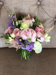 Hand tied bouquet in pastel shades including Roses, Peonies, stocks, and Freesia. Floral design by Cotswold Blooms, wedding florist based in Cheltenham.
