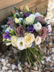 White, dusky pink and purple including Roses, Eustoma and Freesia with a touch of foliage. Floral design by Cotswold Blooms, wedding florist based in Cheltenham.