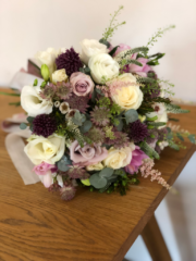 Bouquet in a country garden style including Roses, Astrantia, Allium and Eustoma. Floral design by Cotswold Blooms, wedding florist based in Cheltenham.