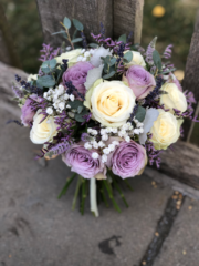 Lilac and cream bouquet including Roses, Limonium and Gypsophila. Floral design by Cotswold Blooms, wedding florist based in Cheltenham.