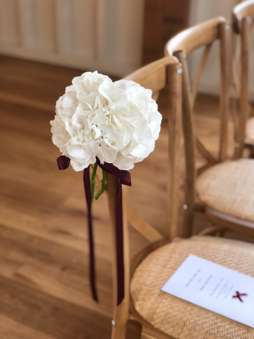 Hydrangea aisle markers with burgundy ribbon. Floral design by Cotswold Blooms, wedding florist based in Cheltenham.
