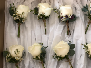 Roses, Waxflower buttonholes. Floral design by Cotswold Blooms, wedding florist based in Cheltenham.