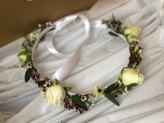 Delicate flower crown of Spray Rose, Heather and Waxflower. Floral design by Cotswold Blooms, wedding florist based in Cheltenham.