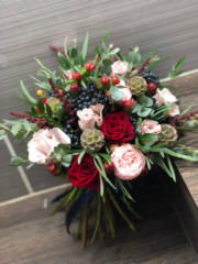 Hand tied bouquet with berry, seed pod and mixed foliage. Floral design by Cotswold Blooms, wedding florist based in Cheltenham.