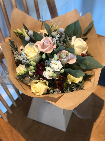 Aqua packed bouquet including Roses, Hypericum and silver foliage’s. Floral design by Cotswold Blooms, wedding florist based in Cheltenham.