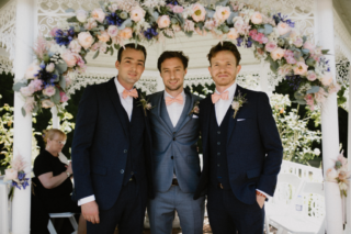 Peach, blue, light pink Roses, Agapanthus, Delphinium and Eucalyptus at Hockwold Hall. Floral design by Cotswold Blooms, wedding florist based in Cheltenham.