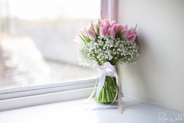 Light pink Tulips with a white Gypsophila collar. Floral design by Cotswold Blooms, wedding florist based in Cheltenham.