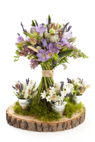 Wild meadow table display using dried and fresh flowers, as showcased in the Wedding Flower Magazine. Floral design by Cotswold Blooms, wedding florist based in Cheltenham.